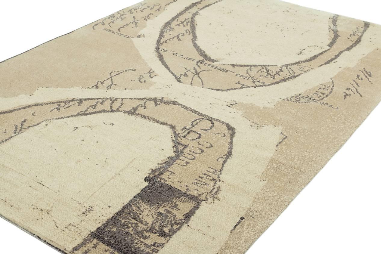 Neutral in color and abstract in its design, this rug is a collaborative work based on the art of Timothy Paul Myers. Timothy's painting overlaps an early 20th century postcard- some of the handwriting and postage stamp shows thru the graphic paint