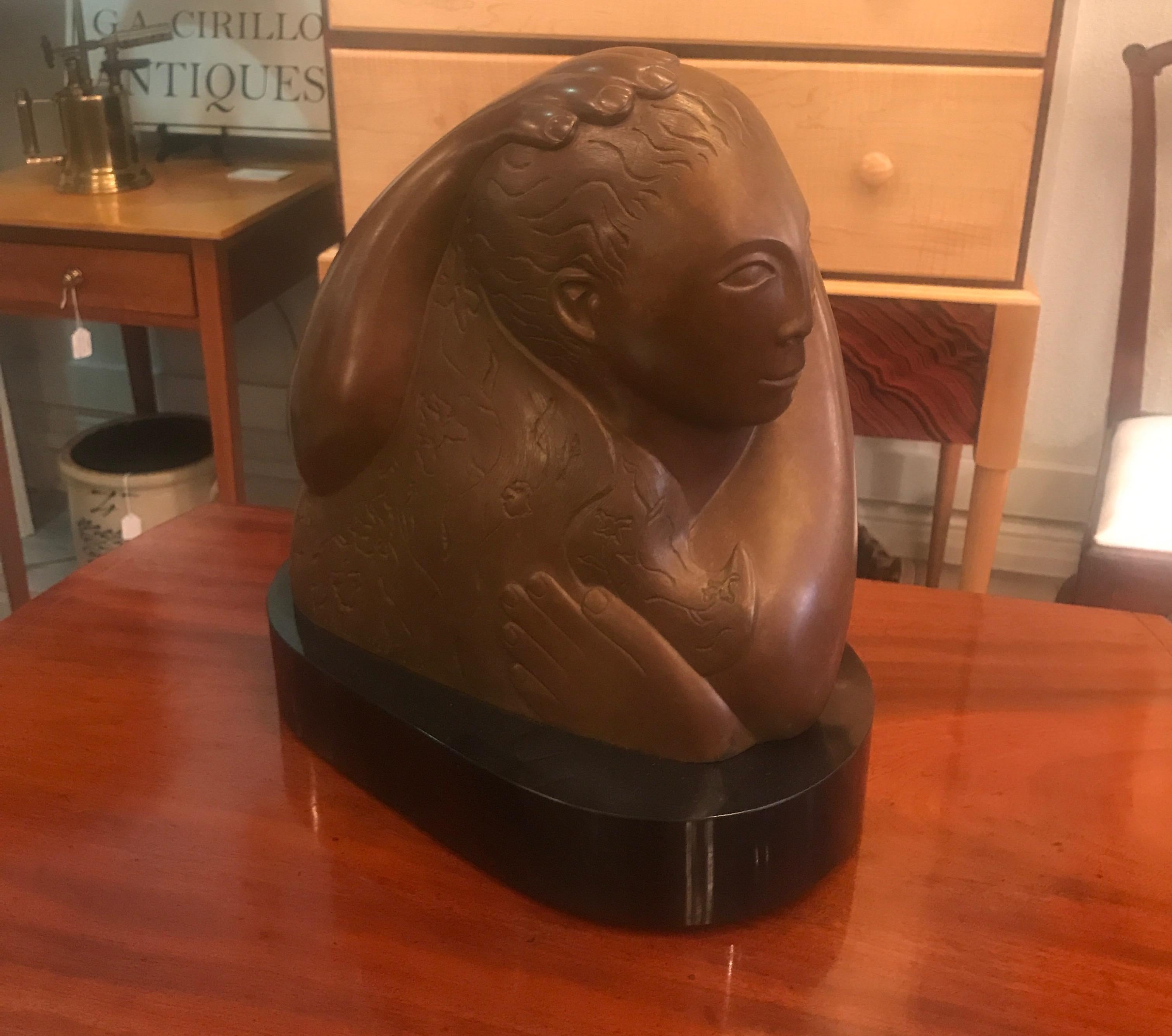 A modern bronze on black base of a stylized mother and child, signed Devorah Sperber 1993
Devorah Sperber was born in 1961 in Detroit, MI, and moved to Denver, Colorado at the age of ten, where she later graduated from the Art Institute of Colorado