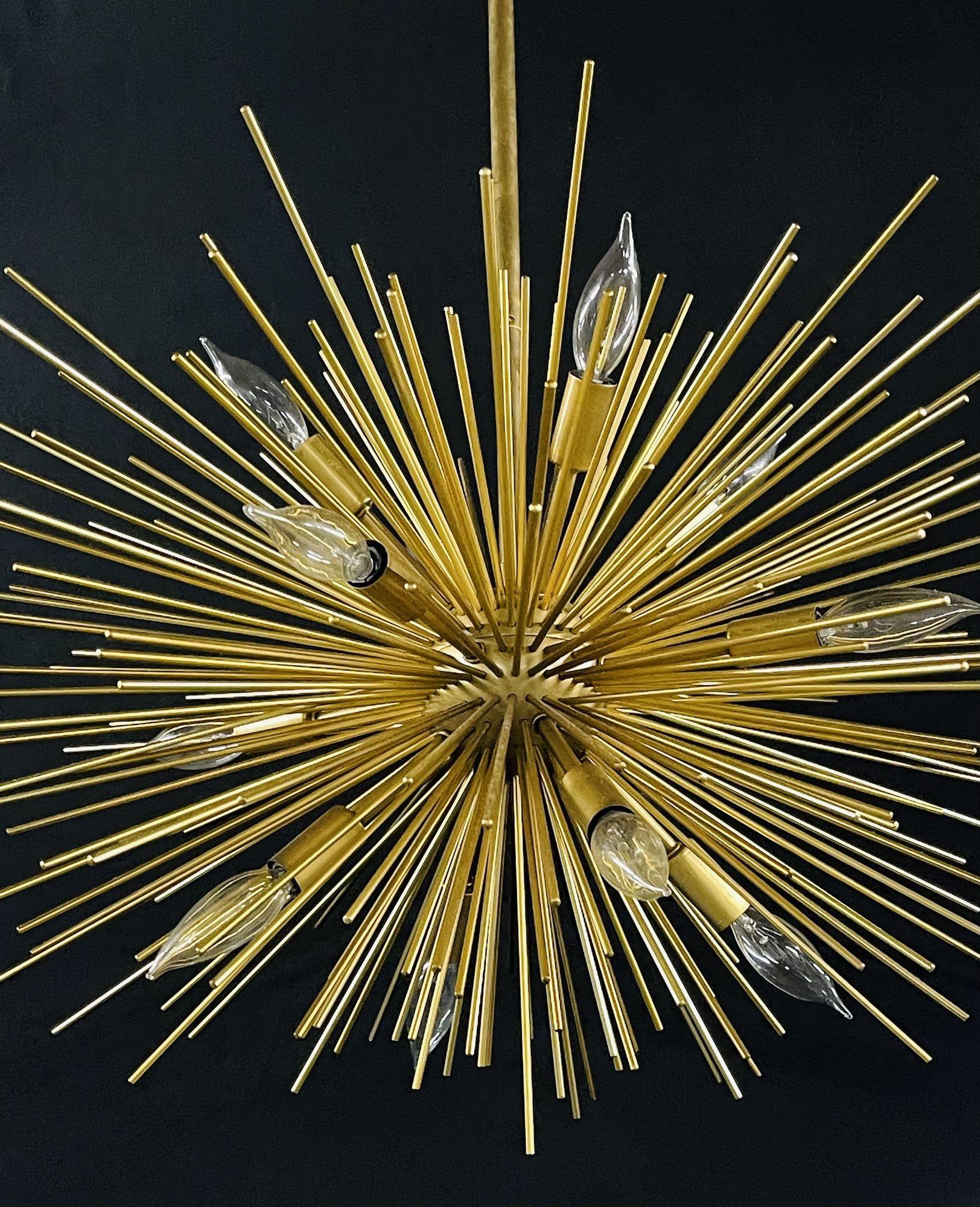 A modern bronze 12 light chandelier, Zanadoo Arteriors
 
Opulent, futuristic and bursting with retro flair, the Arteriors Zanadoo Chandelier recalls the early days of space exploration and innovation. Mid-century aesthetics combine an explosion of