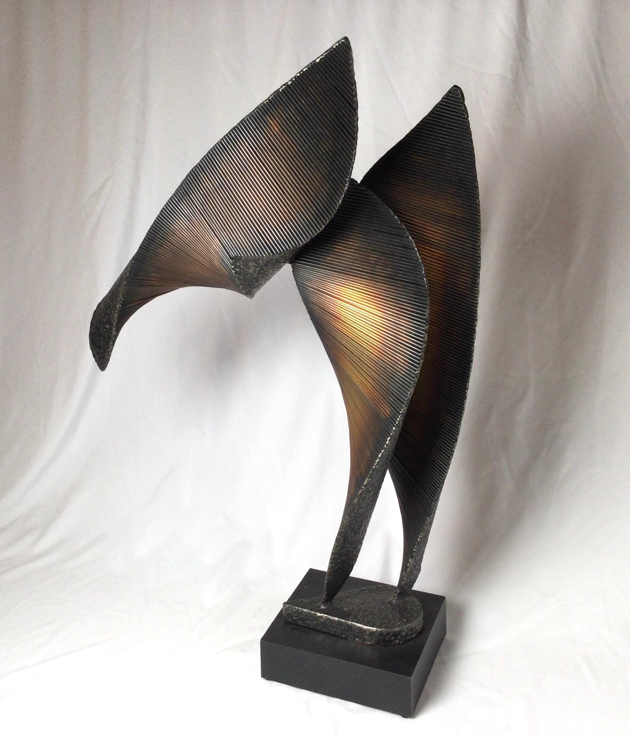 A contemporary welded steel Brutalist abstract sculpture with wood base. The sculpture with three curled sails consisting of steel rods welded together with the backing in a pebbled texture. Signed at base 