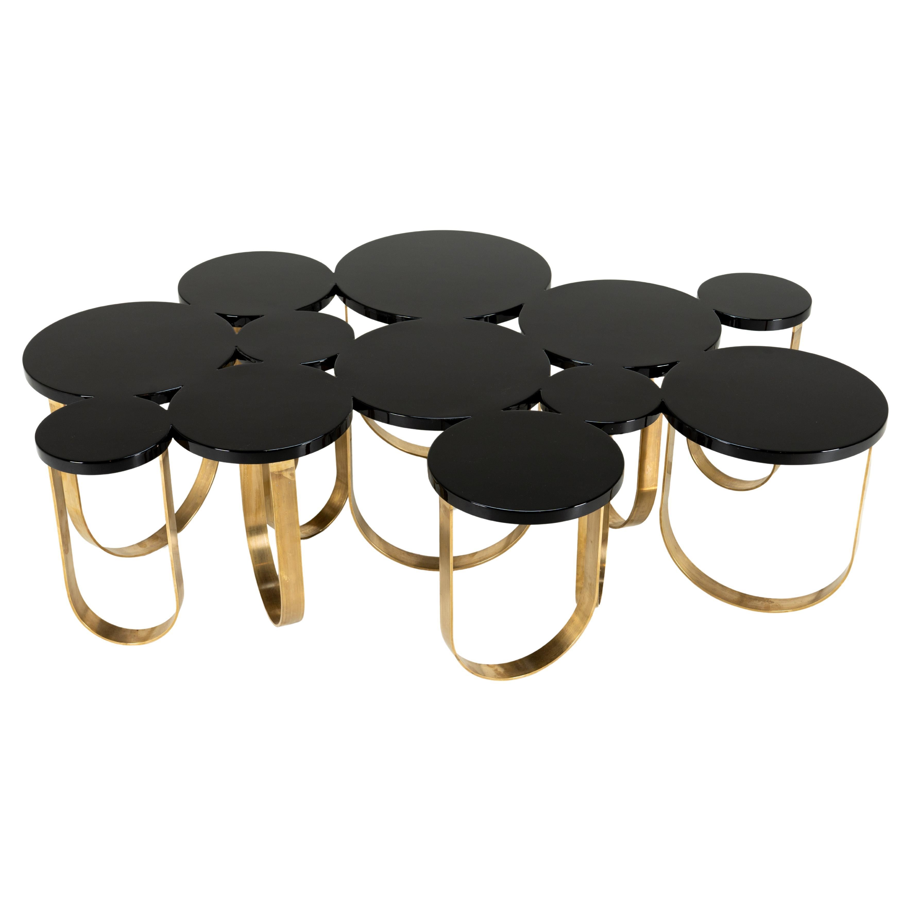 A Modern Coffee Table With Solid Brass Legs and a Black Lacquer Top For Sale