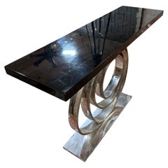A modern console aluminium and wood lacquered