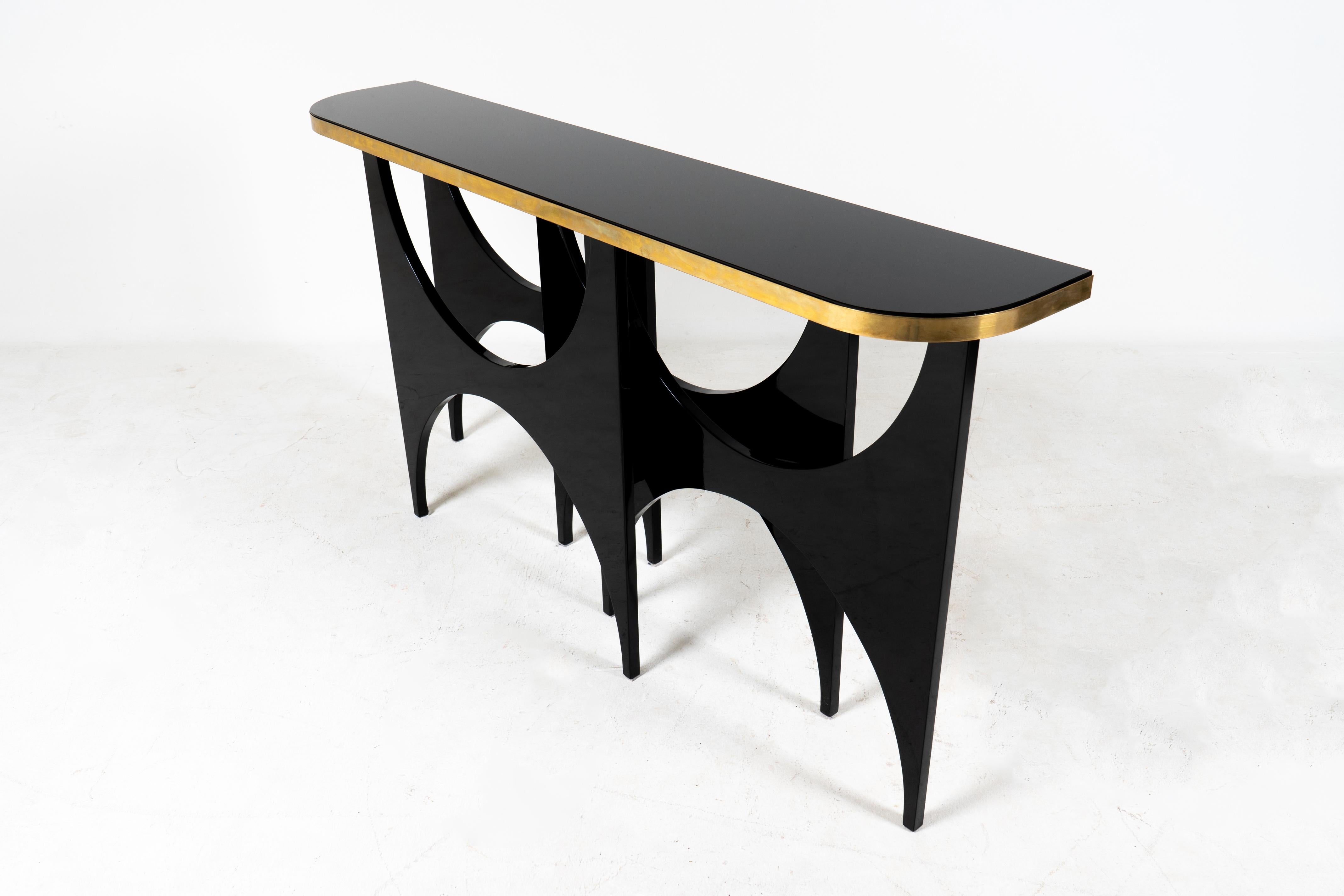 Hungarian A Modern Console Table With Lacquered Base and Black Glass Top For Sale
