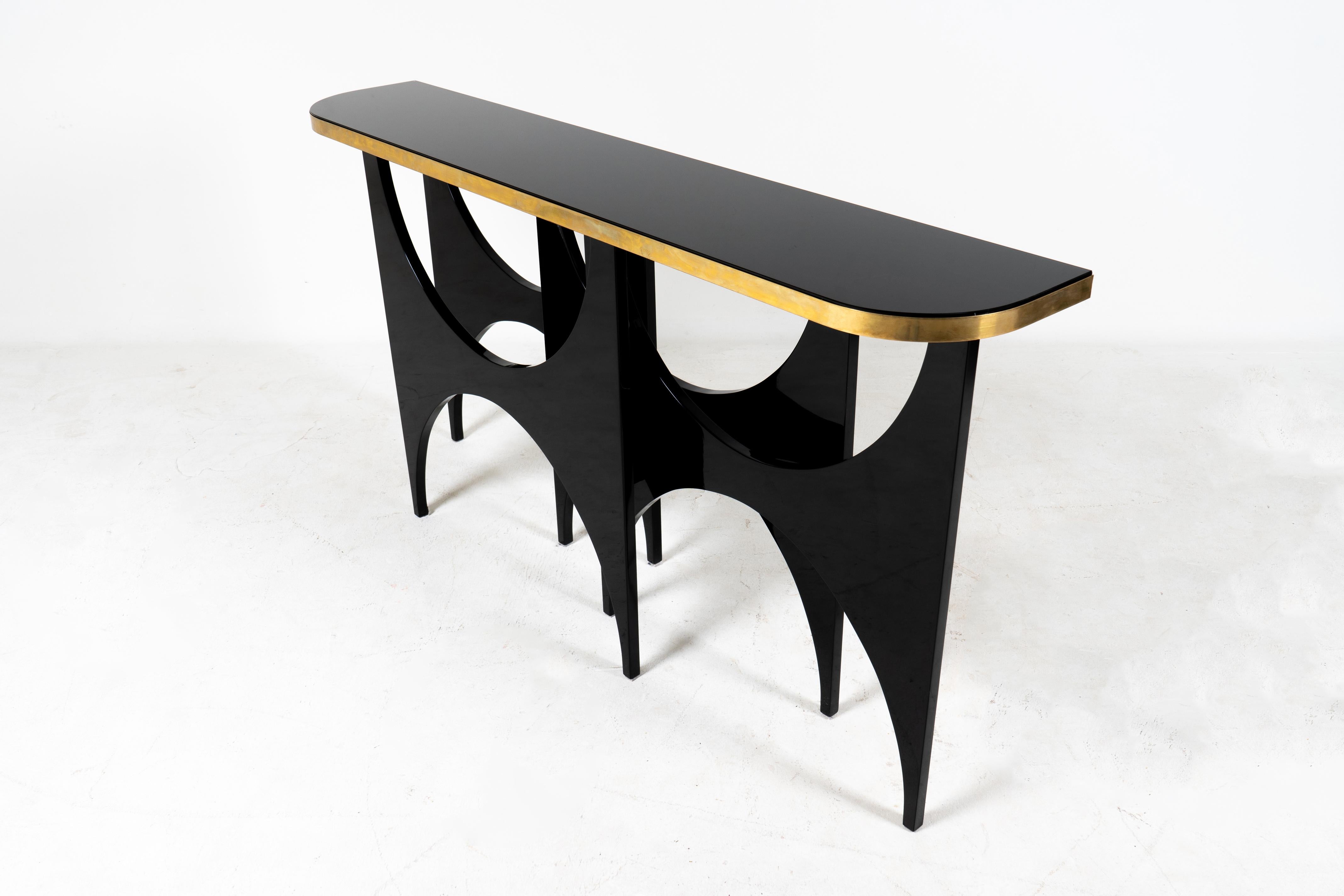 Hungarian A Modern Console Table With Lacquered Base and Black Glass Top
