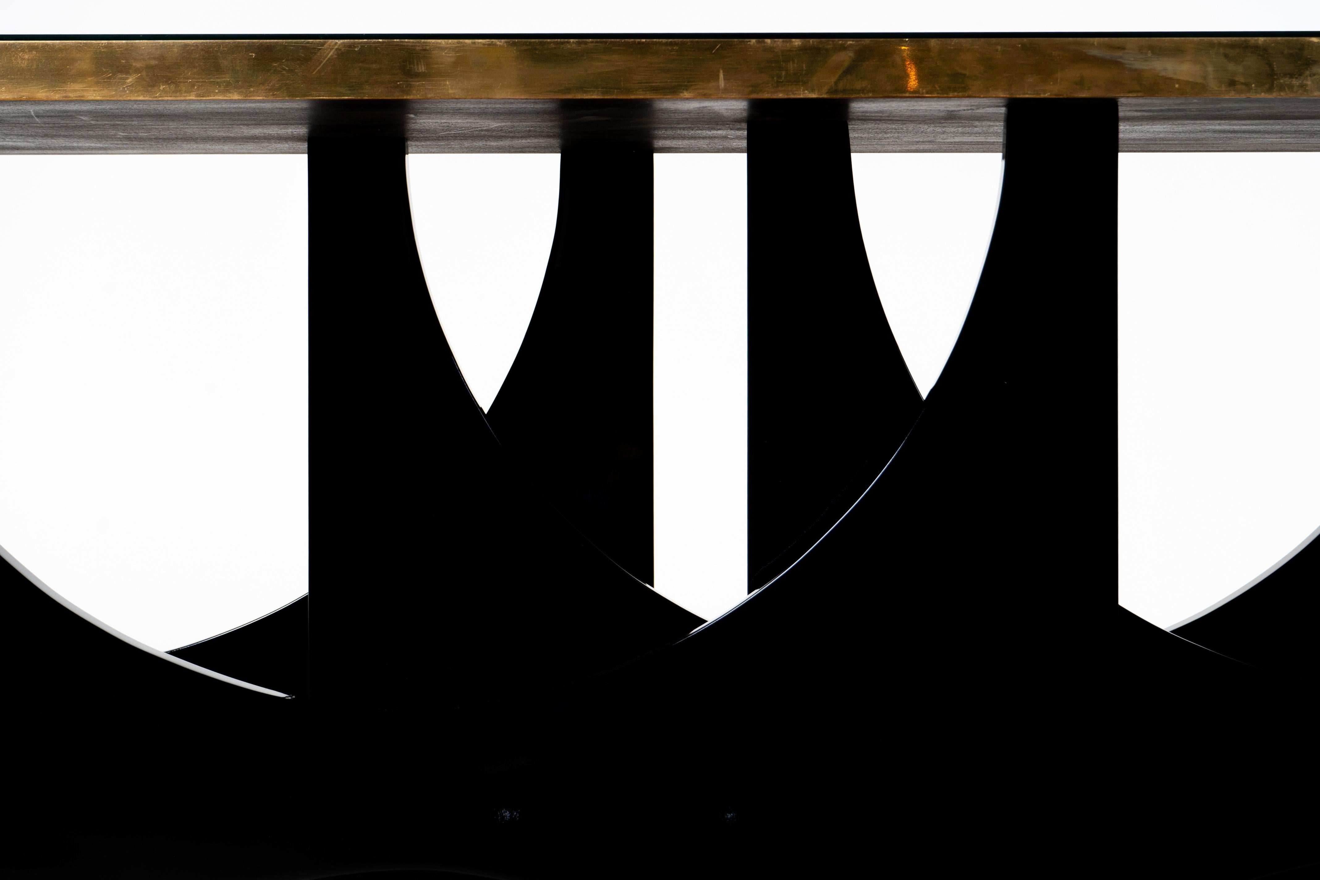 A Modern Console Table With Lacquered Base and Black Glass Top 1