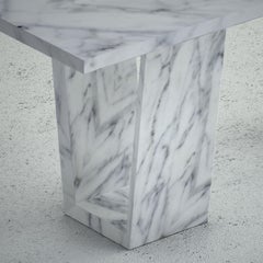 The Elise: A Modern Stone Dining Table with a Rectangular Top and Angled Bases