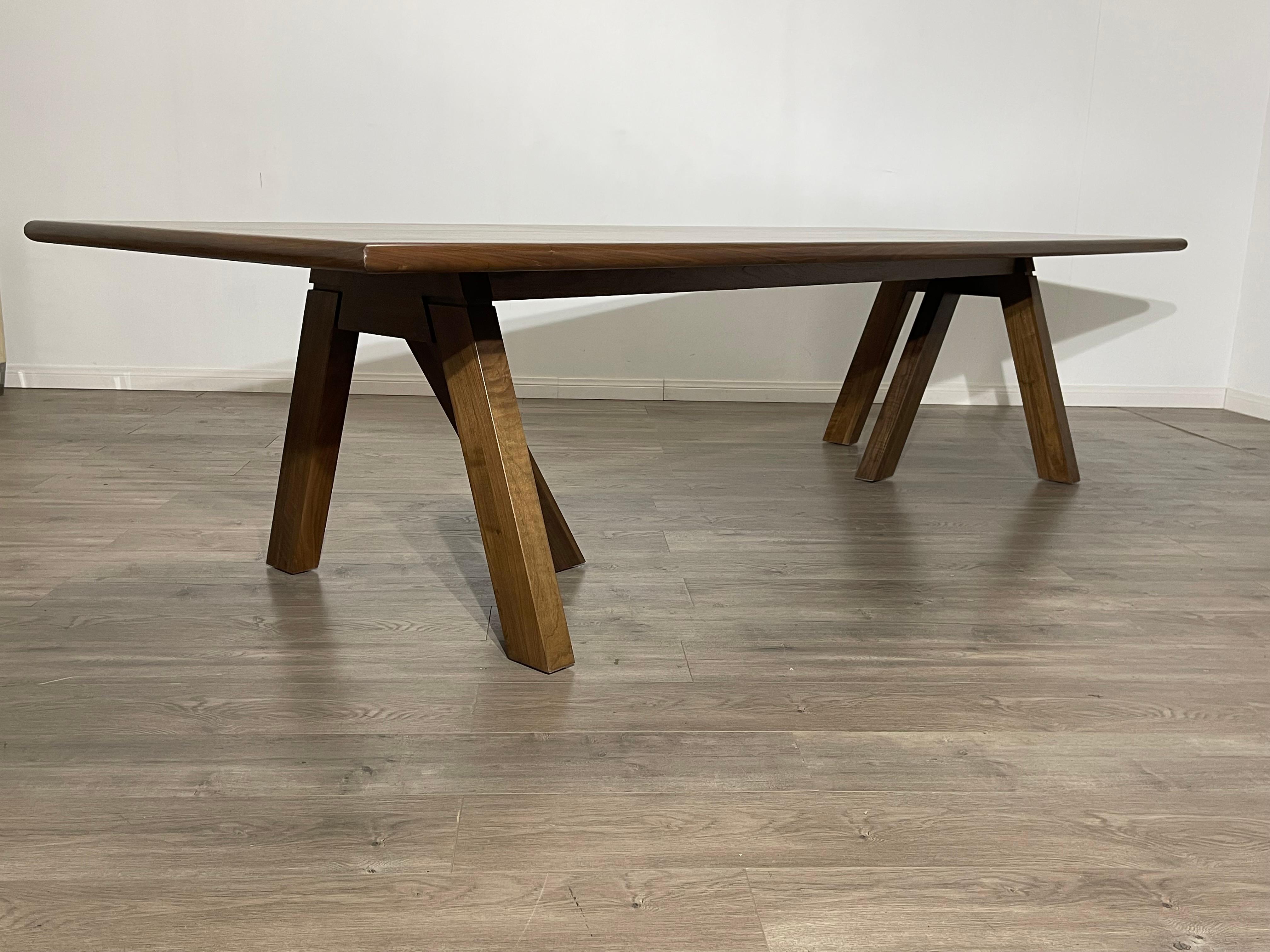 A Modern Custom made to order Dining of Office table. 
Showing the richness of the wood this modern sleek dining table is an exceptional fit for your modern/contemporary home or office. 
Standing on two tripod legs, this table stands 28.5