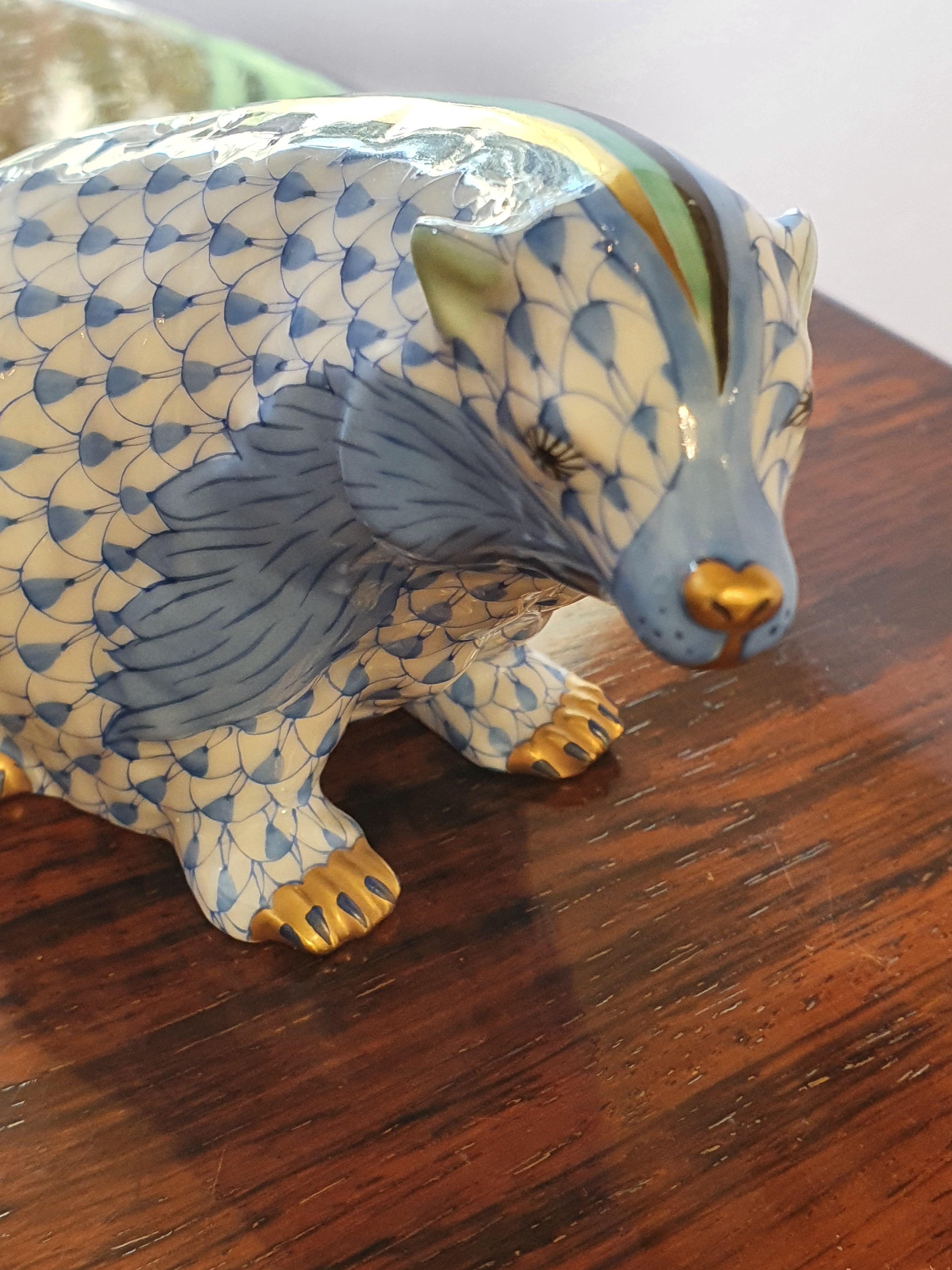 A hand painted blue fish scale badger figurine, golden feet, nose and mane.
New, never used.
Since 1826, Herend's factory has been one of the most famous centers for the production of hand painted porcelain, supplier of royal houses, aristocrats