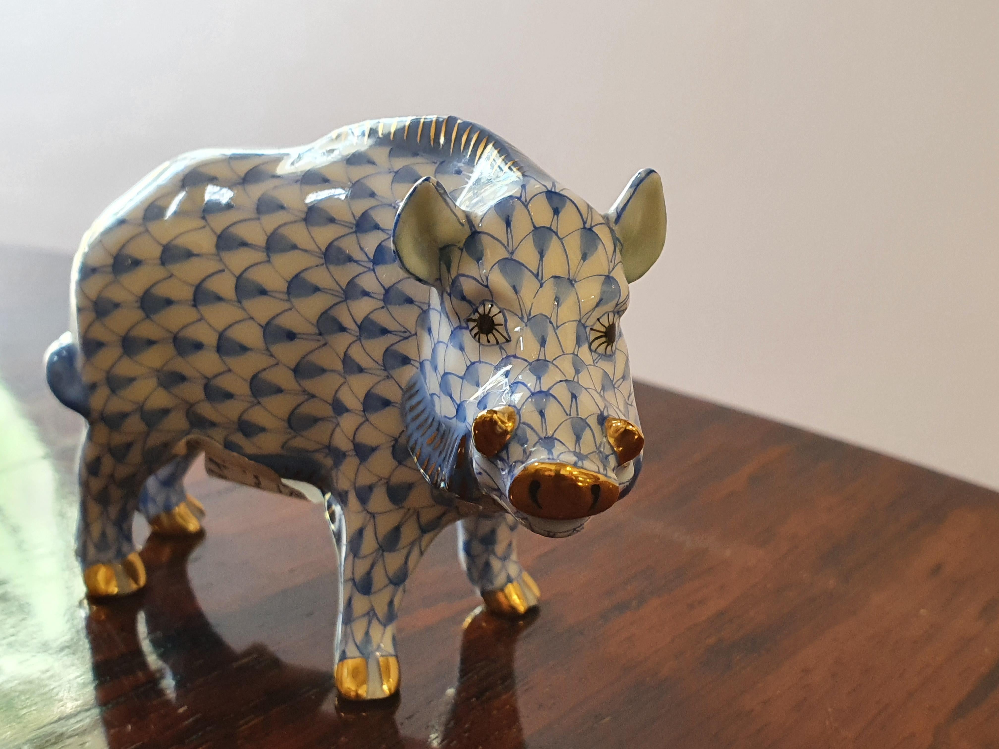 A hand painted blue fish scale wild boar figurine, golden feet, nose and fangs.
New, never used.
Since 1826, Herend's factory has been one of the most famous centers for the production of hand painted porcelain, supplier of royal houses,
