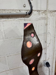 A modern iron and glass lamp