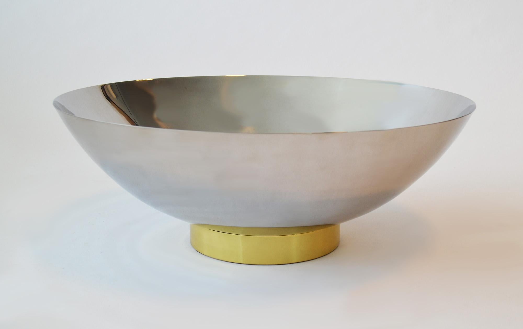 A modern mirror polished chrome and brass centerpiece bowl Art Deco machine age
A modern mirror polished chrome and brass centerpiece bowl c. 1990's 
Sally Sirkin Lewis for J. Robert Scott designs, Los Angeles, USA, purchased mid- to late-