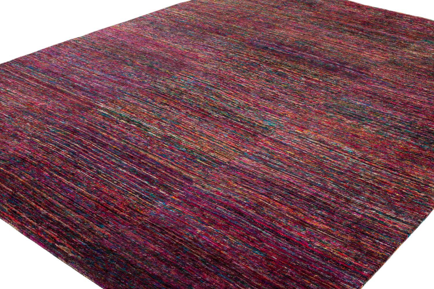 This multi-color rug was created using recycled sari's silk. It is incredibly soft and you find yourself constantly seeing new details. The variation in color is beautiful and will add to any room a pop of needed color. The dominant colors are