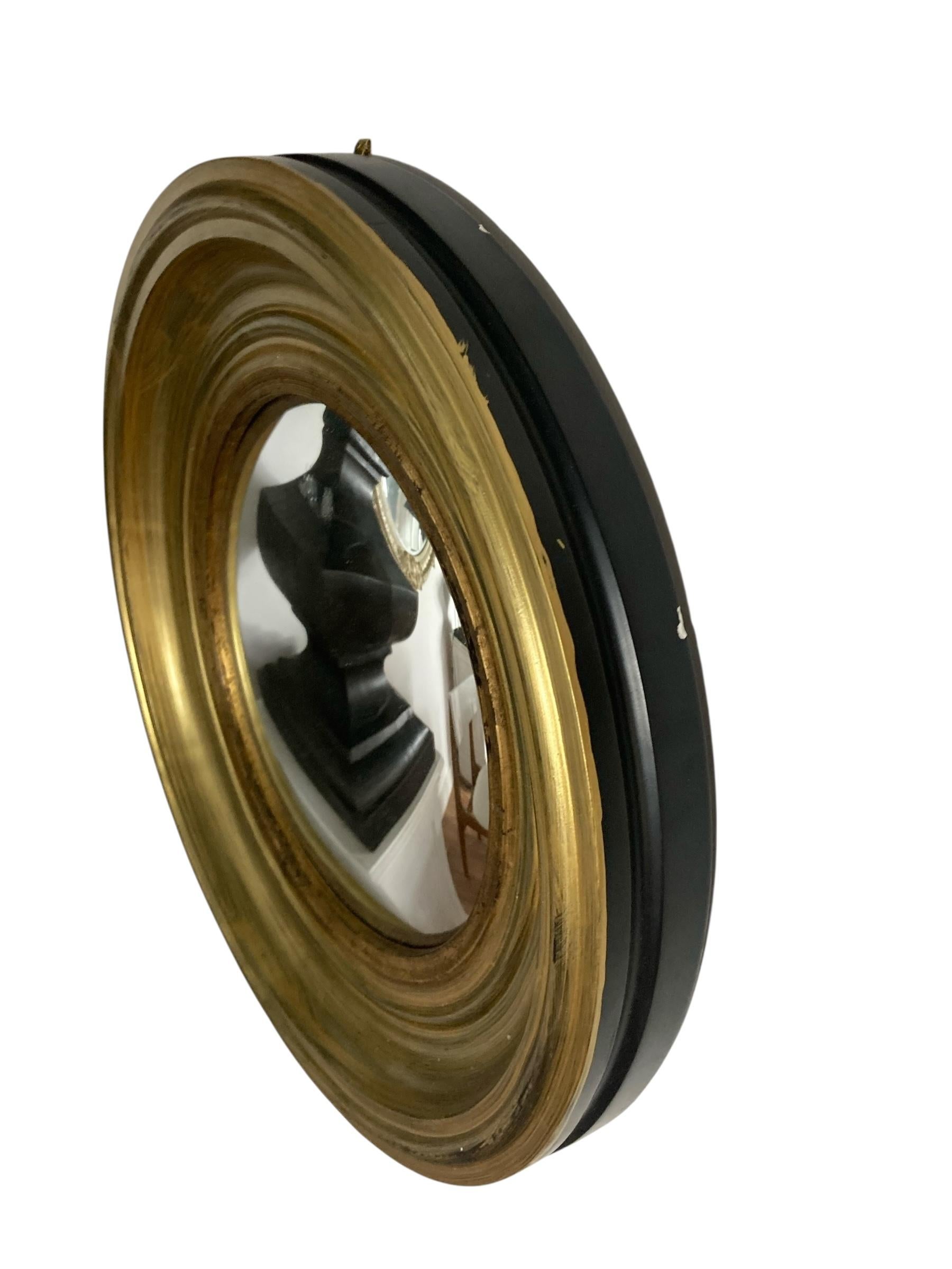 A Modern Regency Style Gold Circular Convex Mirror with ebonsied Rim For Sale 1
