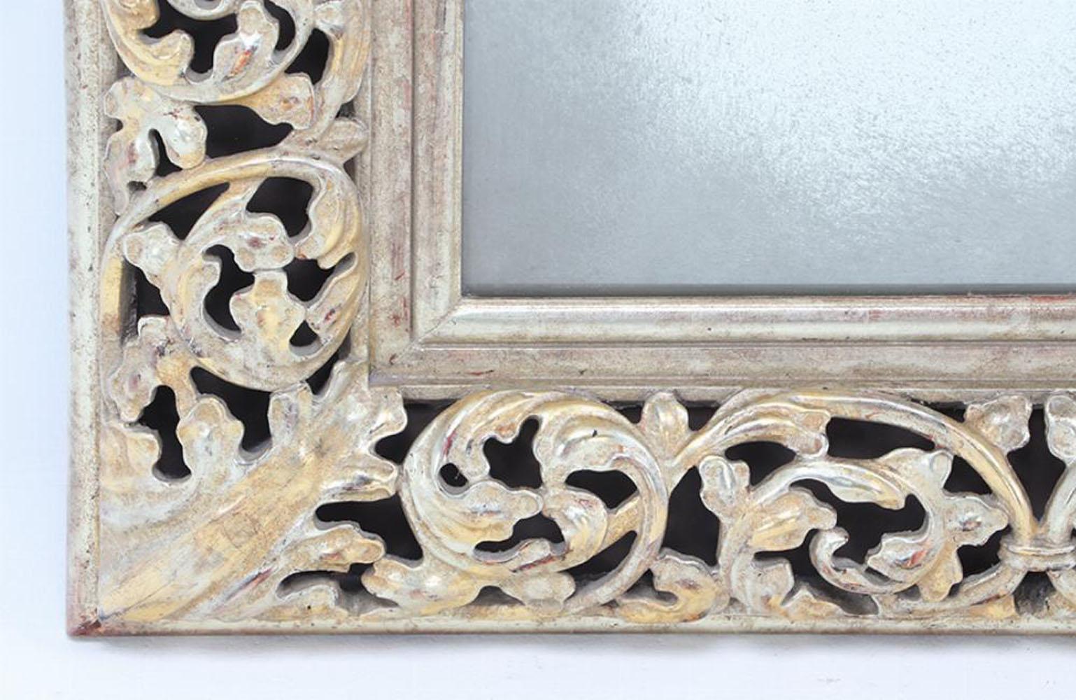 European A silver gilt carved wood mirror. For Sale