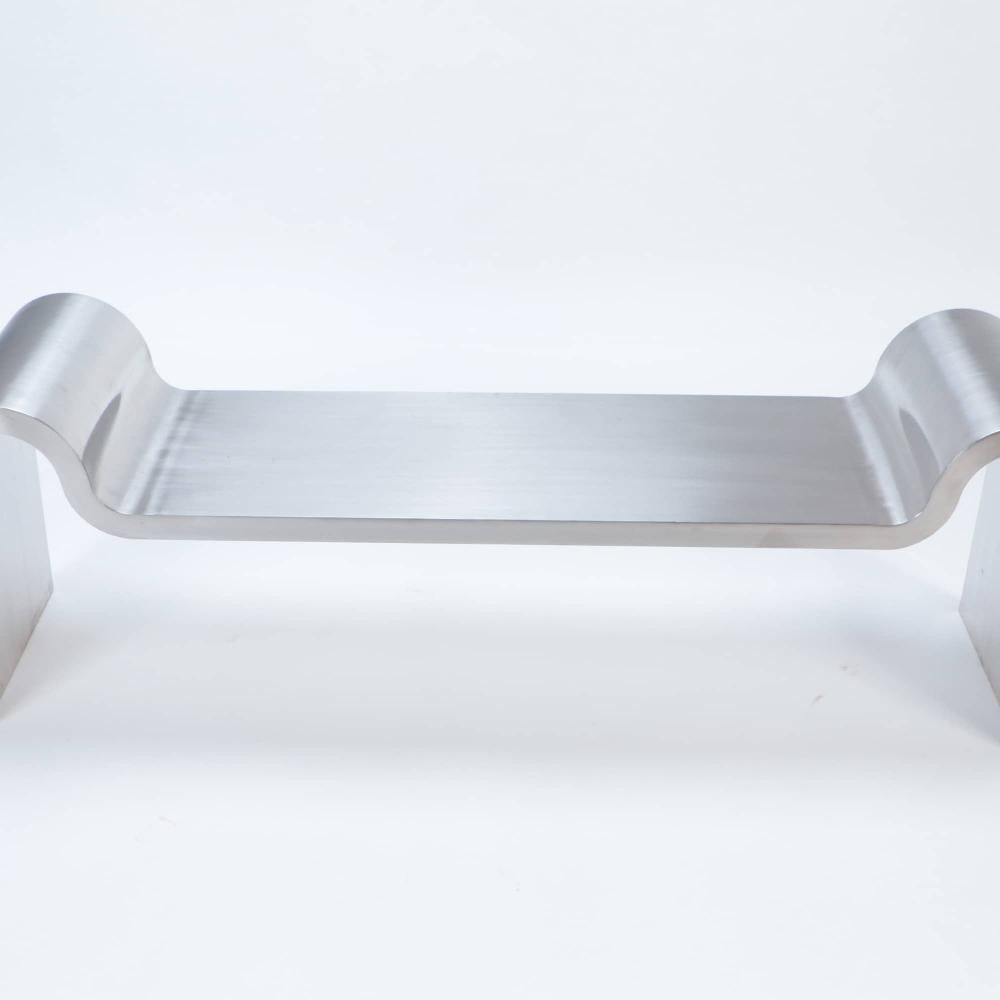 A Modern Stainless steel and leather bench in the manner of Karl Springer. 1