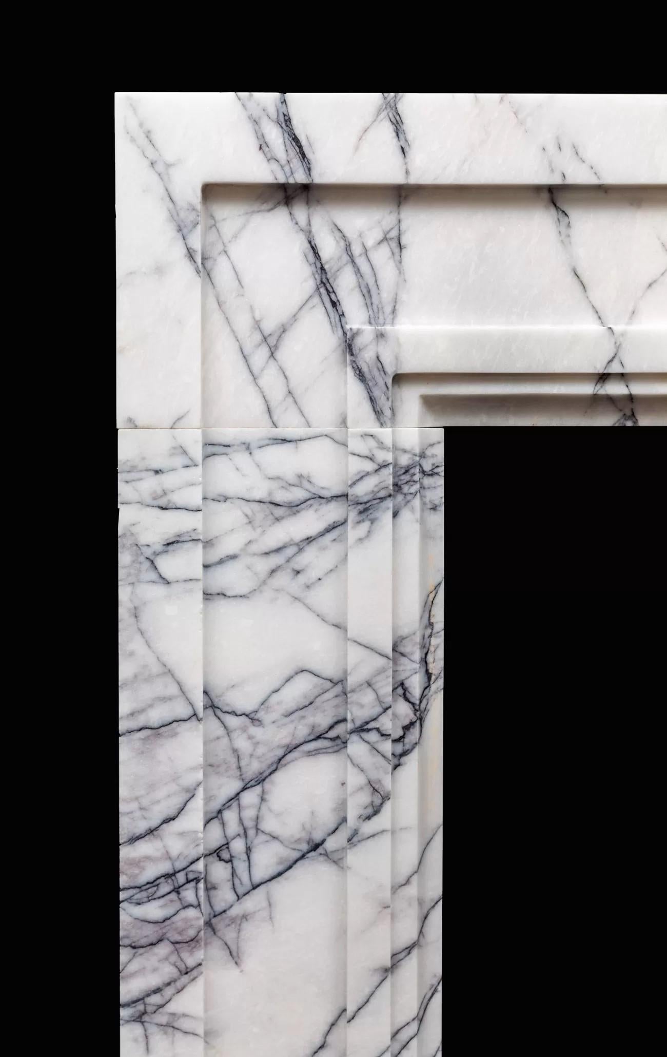 An early 20th century design which has a very modern appearance when produced in this strongly veined lilac marble.

The shape encapsulates simple architectural form and it's this simplicity that really shows off the richness in such a luxury