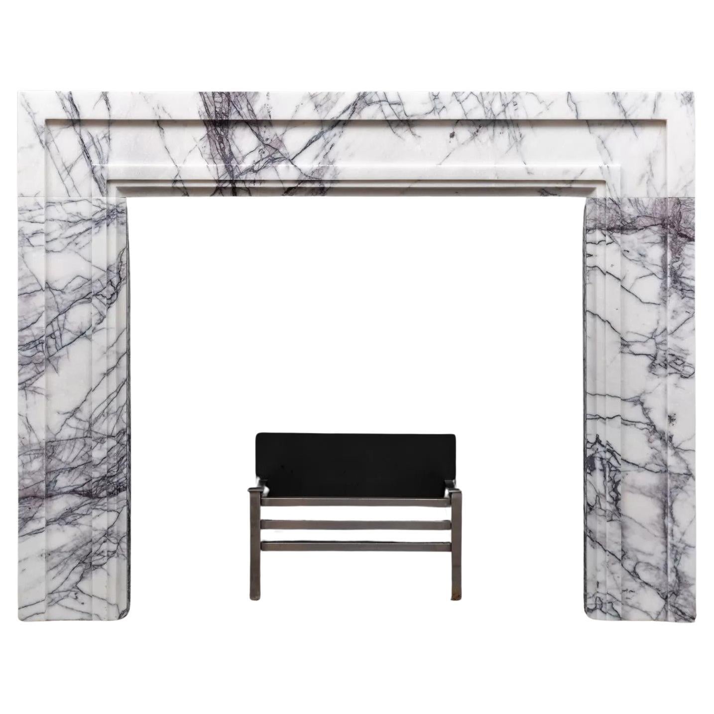 A modern styled lilac marble mantel made by Ryan & Smith