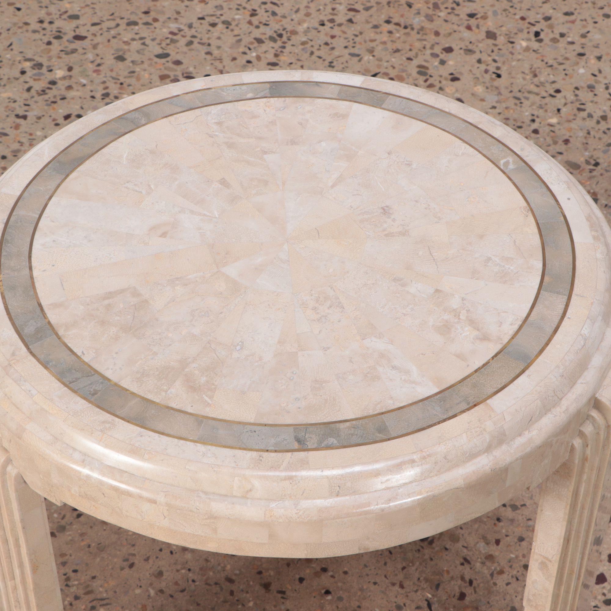 A Modern tessalated marble Art Deco style occasional table with brass trims.