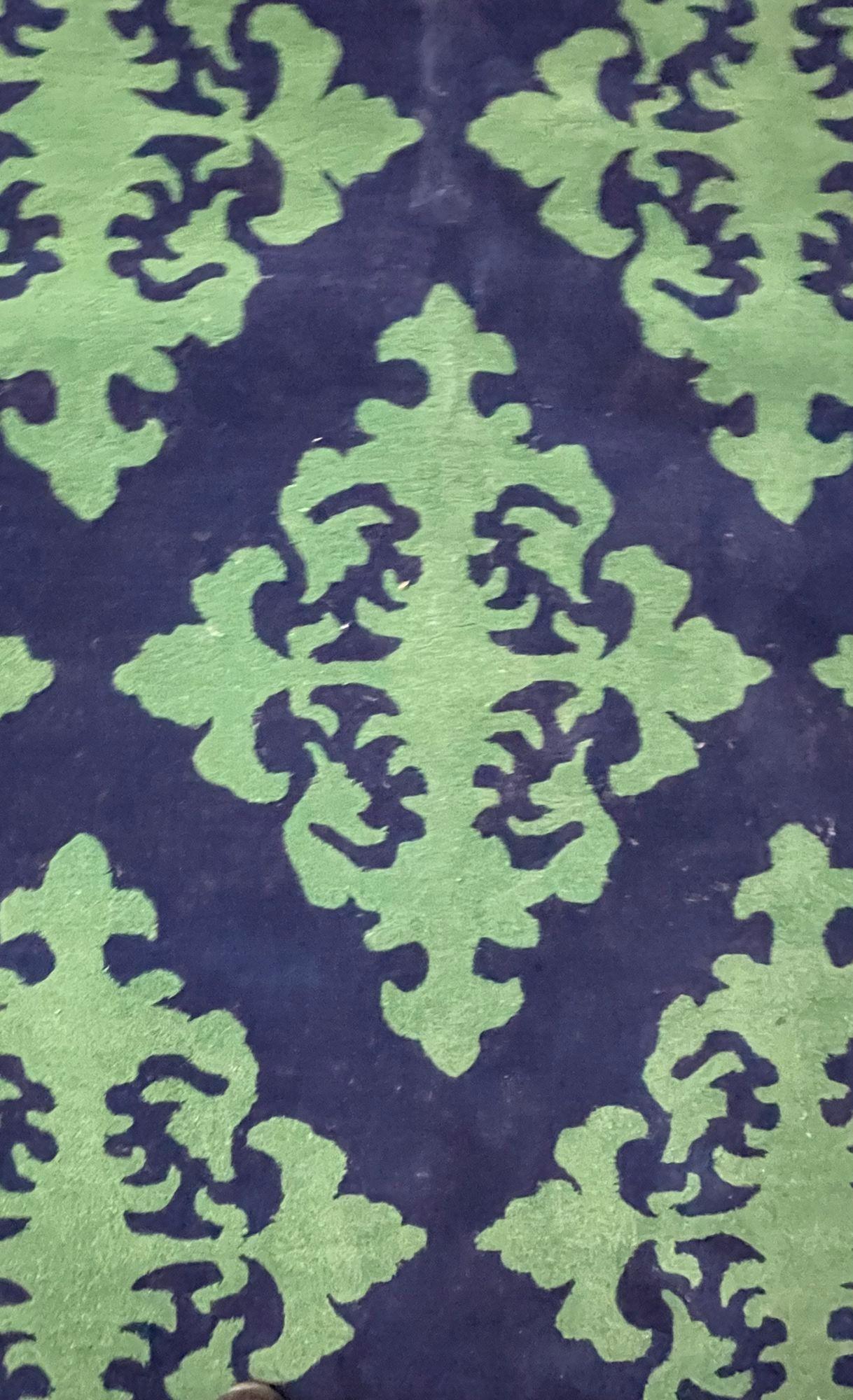A Modern Wool Carpet, Rug, Wool Five by Seven Feet Nine Inches
 
By Kaleen. A fine thick wool pile having a geometric design of blue and green colors. 