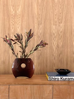 A modernist art glass “donut” vase in aubergine, late 20th century