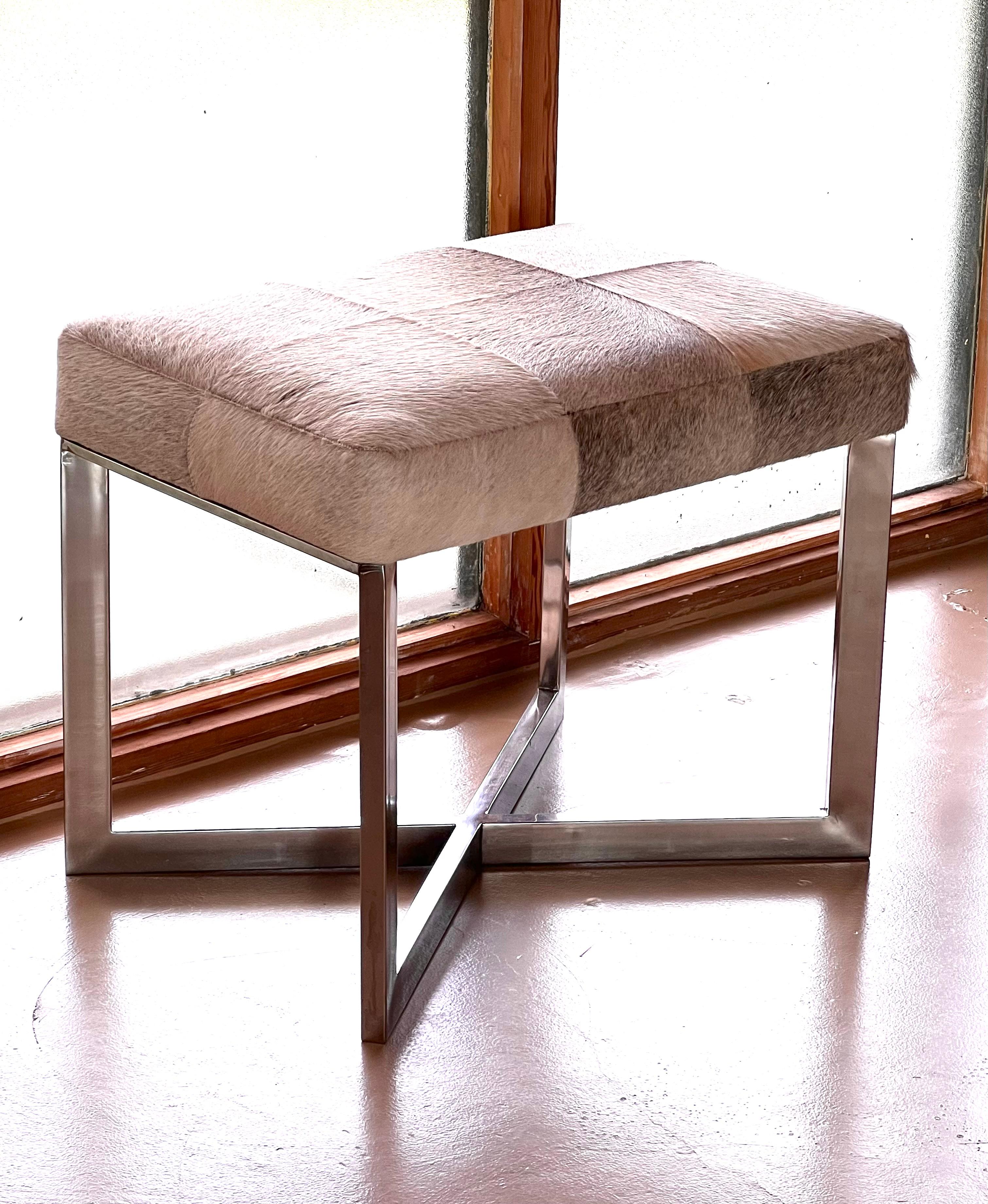 A modernist cowhide and chrome ottoman, 20th century. For Sale 6