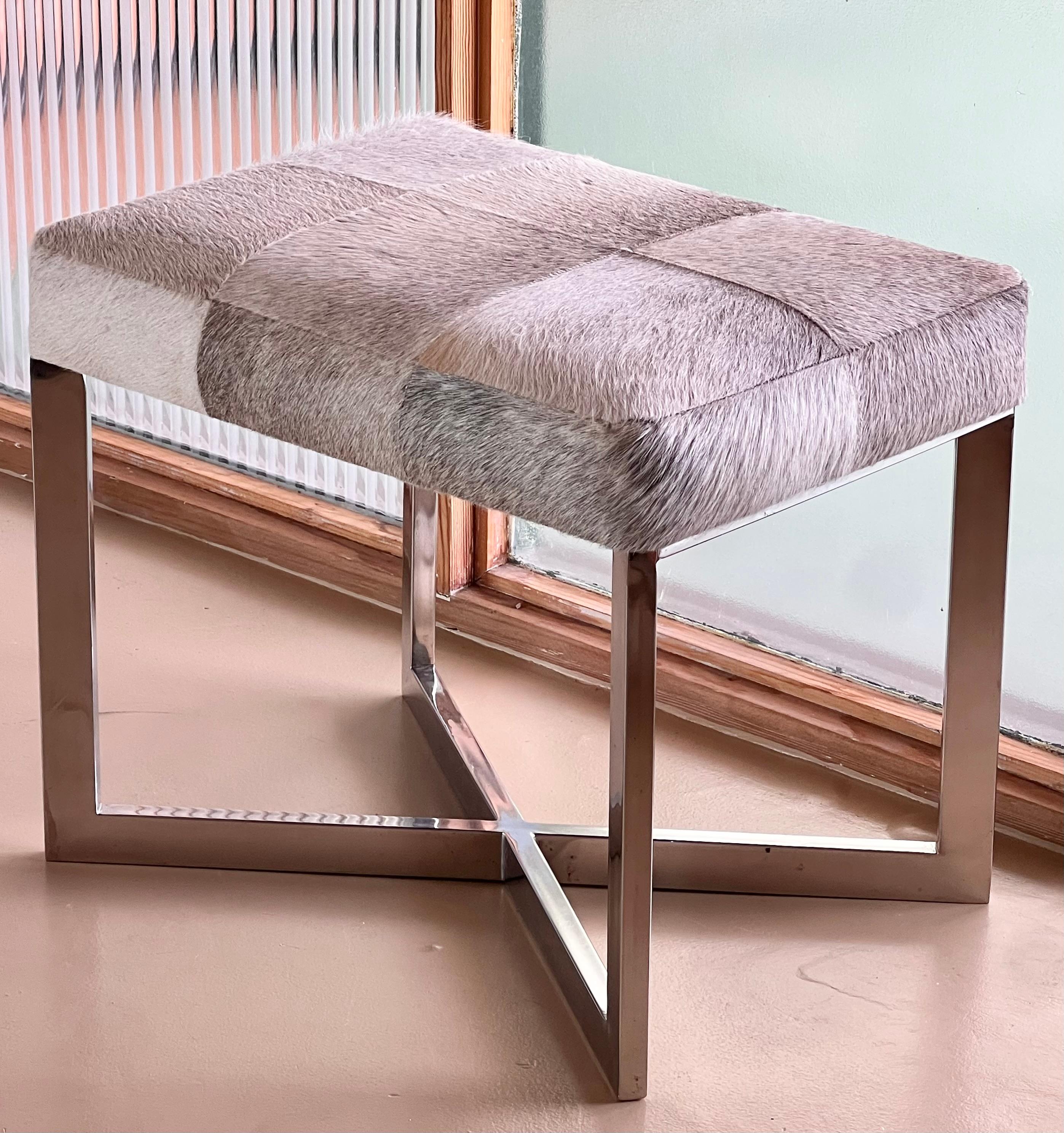 A modernist cowhide and chrome ottoman, 20th century. For Sale 9