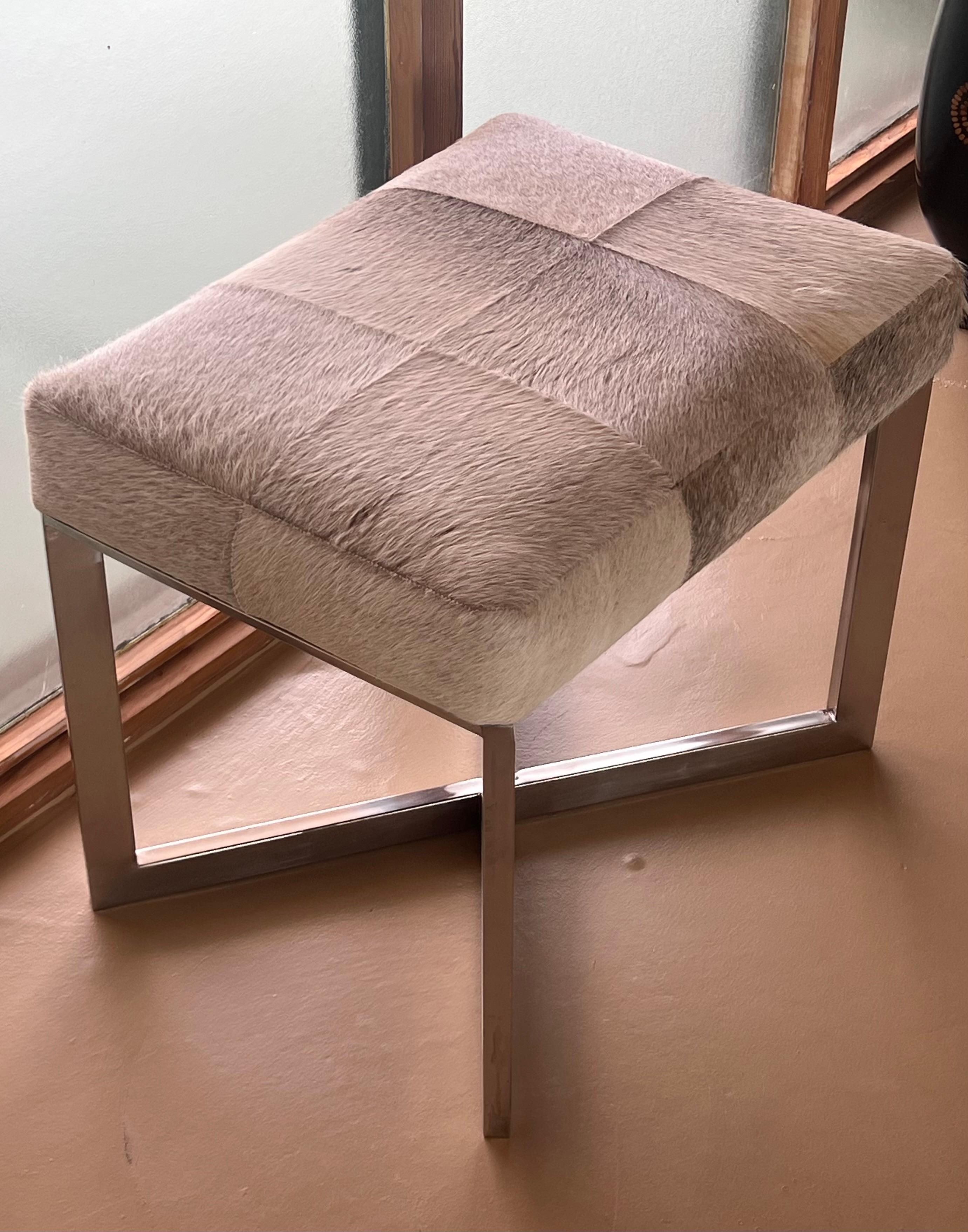 A modernist cowhide and chrome ottoman, 20th century. For Sale 10