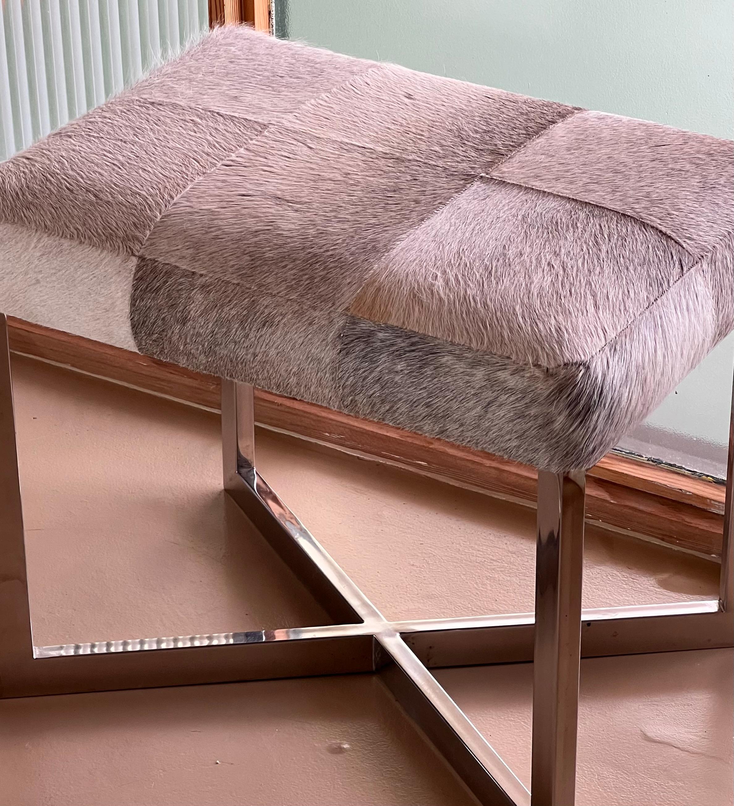 A modernist cowhide and chrome ottoman, 20th century. For Sale 12