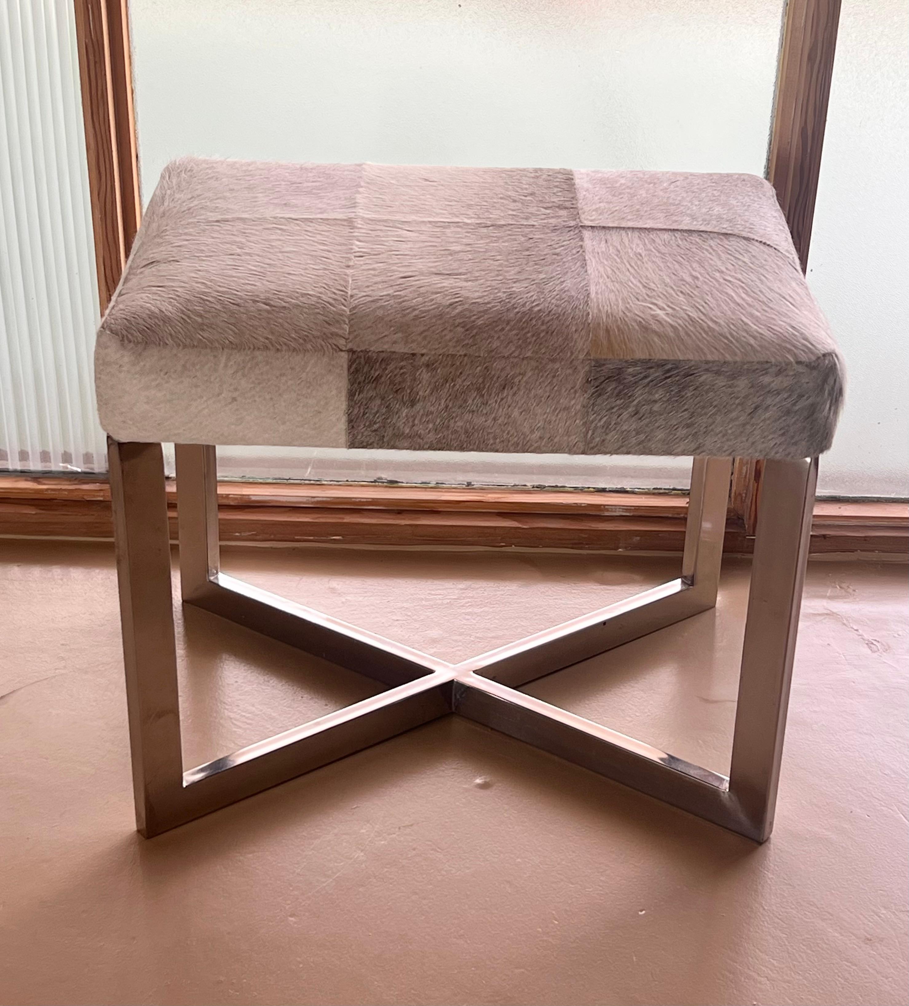 Unknown A modernist cowhide and chrome ottoman, 20th century. For Sale