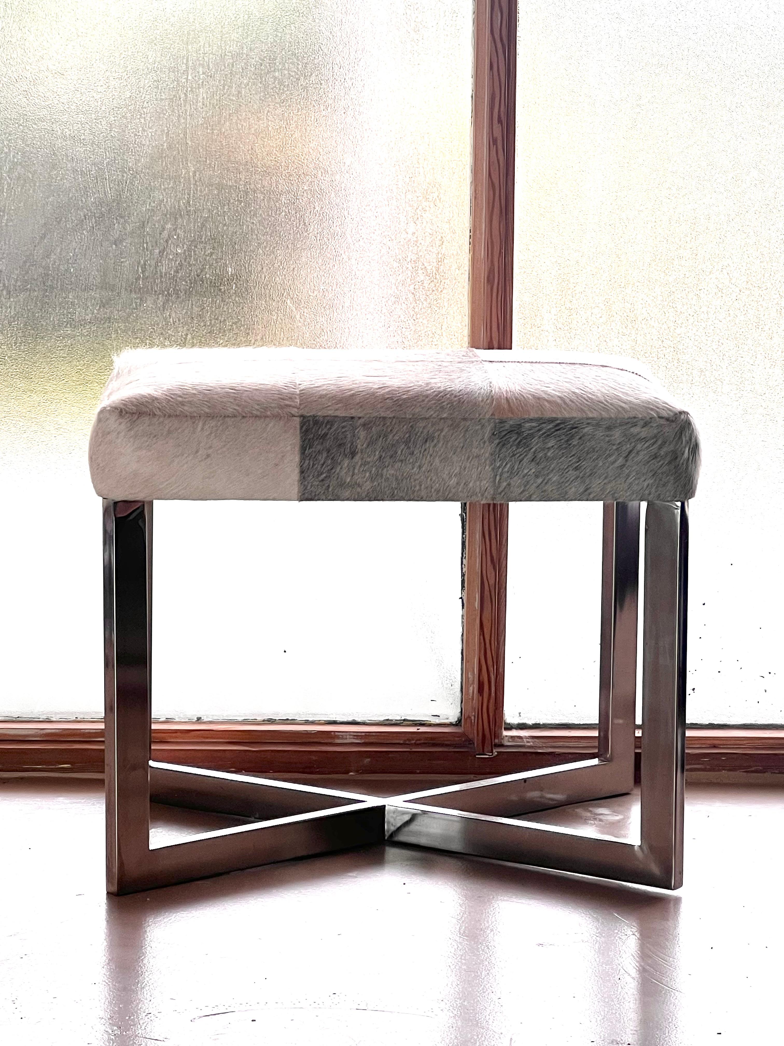 A modernist cowhide and chrome ottoman, 20th century. For Sale 1
