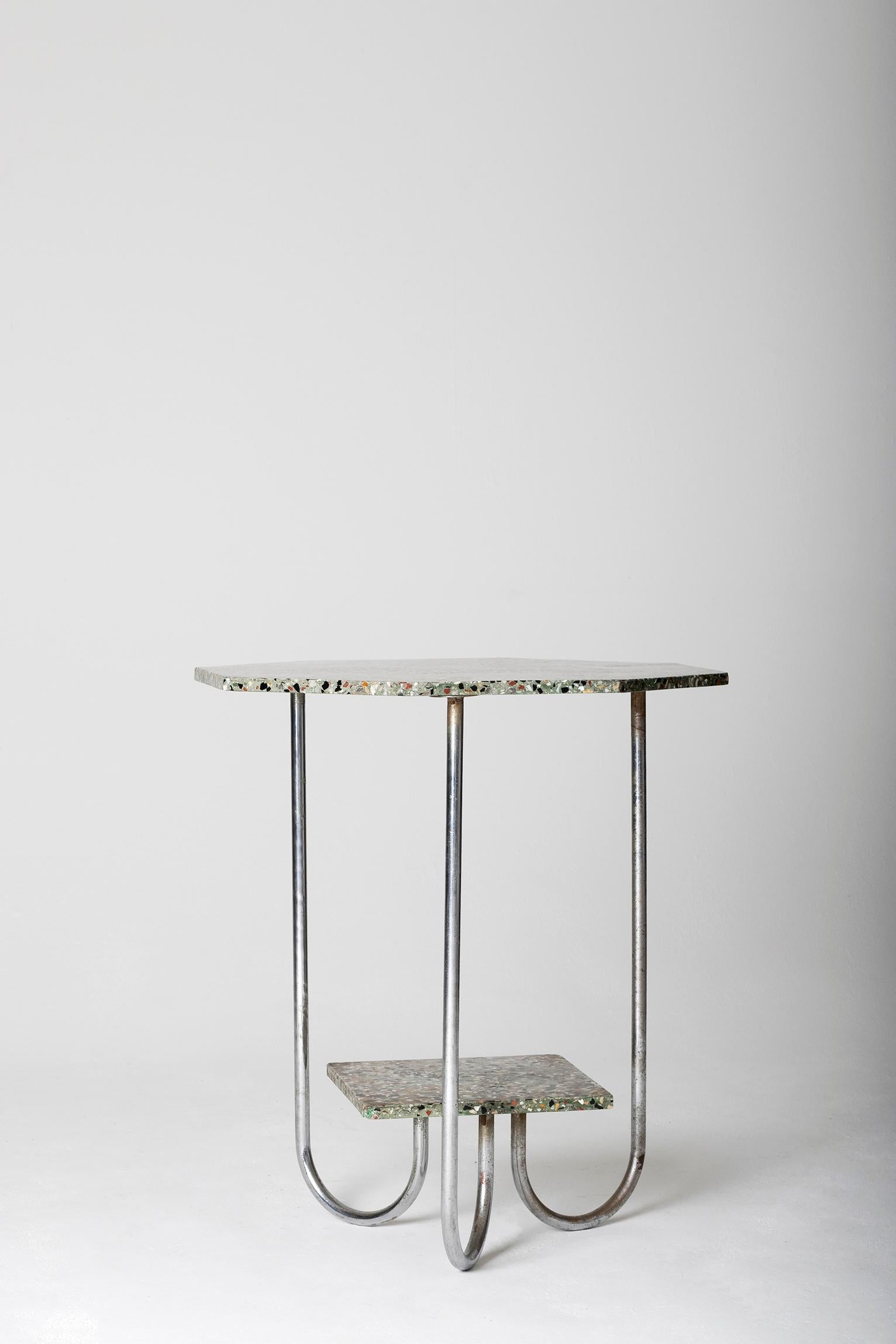A modernist terrazzo and chrome two-tiered octagonal gueridon
France, circa 1930.
 