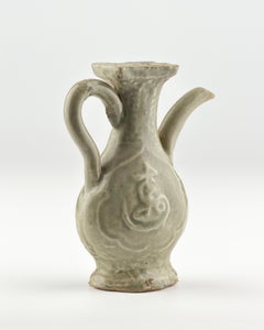A Molded Longquan Celadon 'Fu Shou' Ewer, Ming Dynasty