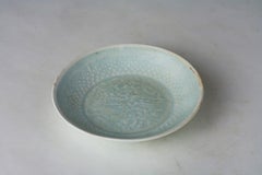 A Molded Qingbai 'Flowers' Dish, Southern Song Dynasty