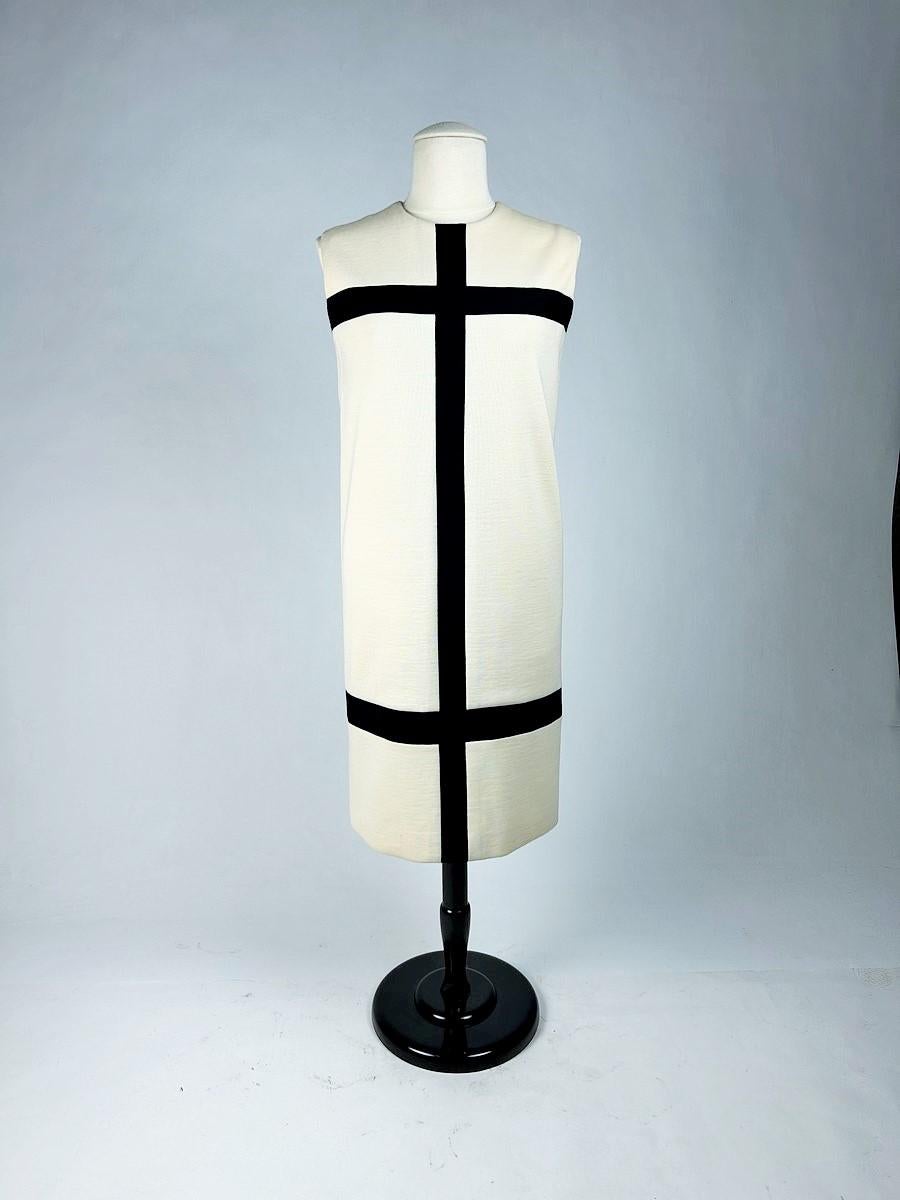Autumn Winter 1965-1966

Paris

Iconic Mondrian dress by Yves Saint Laurent Haute Couture (attributed to) dating from the 1965-1966 period. Sleeveless cocktail dress in off-white wool jersey with black jersey inlay, revealing no seams. The back zip