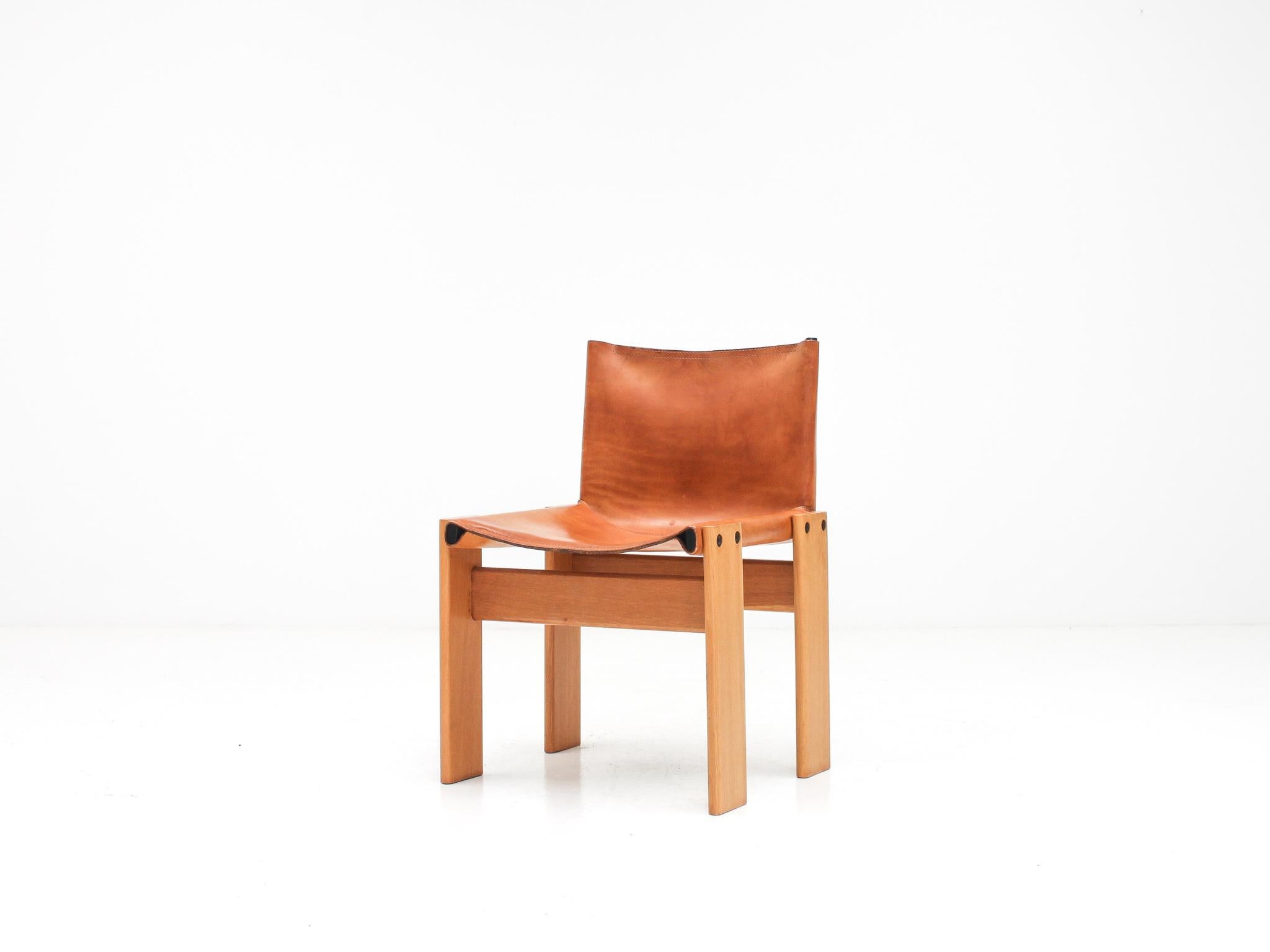 A single 'Monk' chair by Italian award-winning designer couple Afra & Tobia Scarpa. 

Patinated Ash wood and thick original saddle leather, the design is high-quality, minimal and solid. Manufactured by Molteni, Italy, 1974. 

A stunning piece