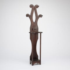 A  monogrammed 19th century Tramp Art hall tree with pipe holder.