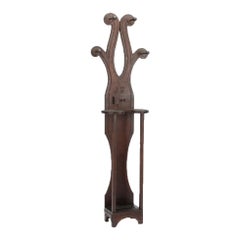 A  monogrammed 19th century Tramp Art hall tree with pipe holder.