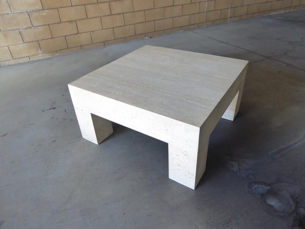 A monolithic, Parsons-style coffee table of Italian Travertine. Measures: 39