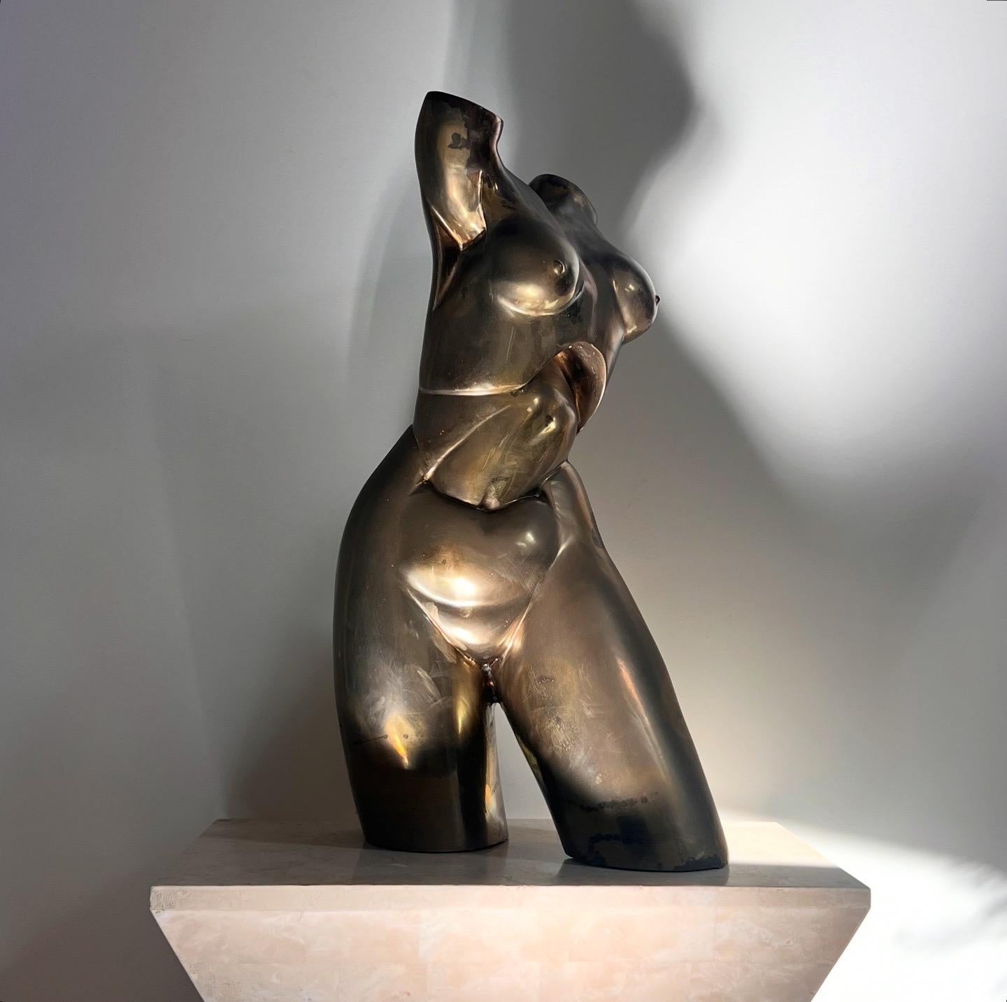 A monumental nude sculpture of a femme torso in bronze by Hattakitkosol Somchai, signed, circa 1970. A striking rarity of Somchai’s oeuvre, this piece stands at nearly twenty-six inches tall, her slightly deconstructed body jutting in different