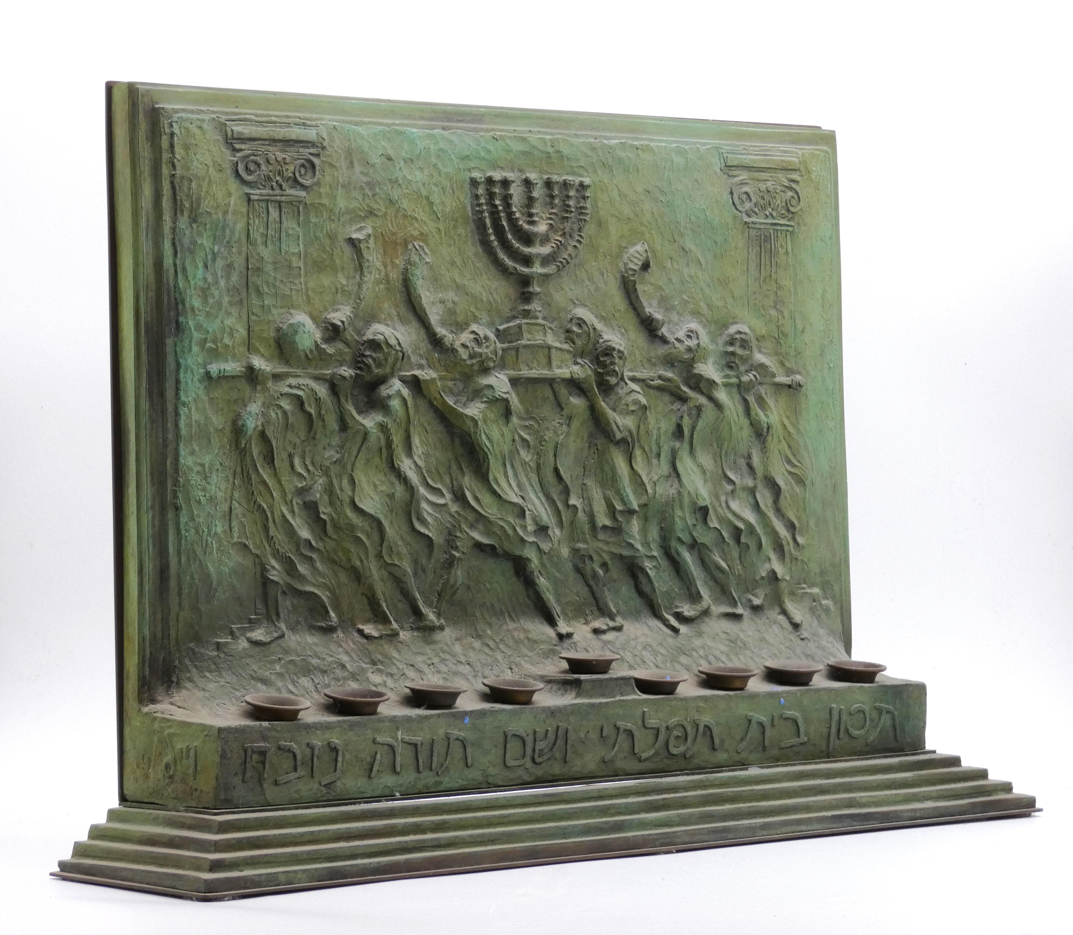This Hanukkah lamp sculpture is truly spectacular with its artistic realism and graphic detailing on its front main body.

Displayed at front is the scene of the Jewish people returning to Israel with  Holy Menorah used in the ancient times of the