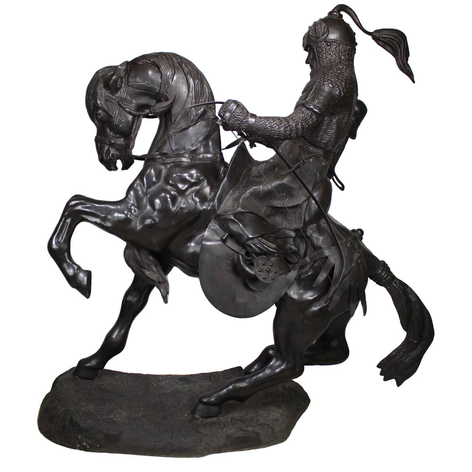 A Monumental Equestrian Patinated Bronze Group Sculpture of 