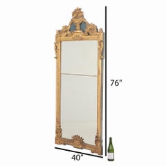 Un monumentale specchio francese in stile Luigi XVI con ornamento in legno dorato, C.C. 1850.