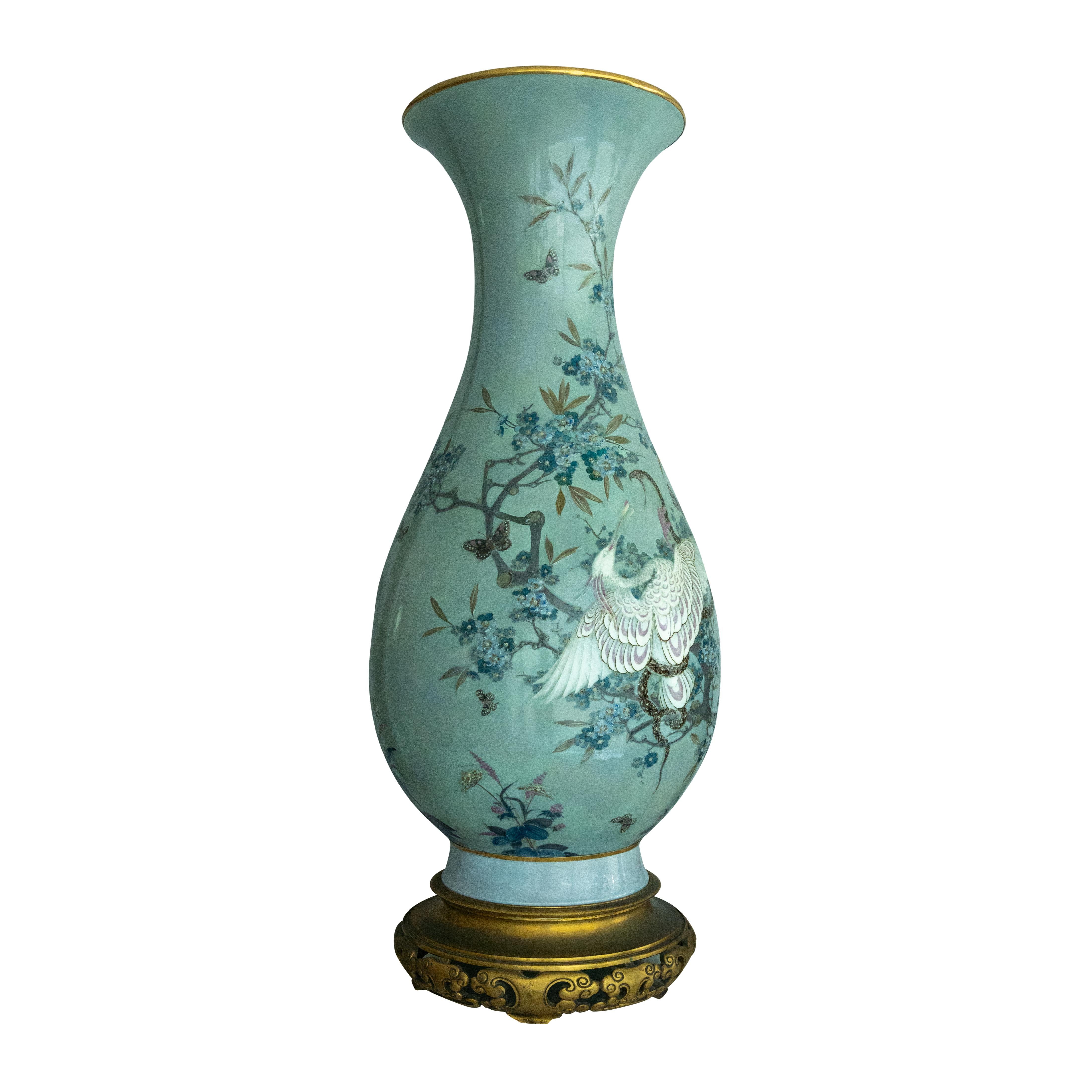 An imposing and rare Sevres (Second Empire) Polychrome Pate-Sur-Pate Celadon Ground Vase in the Japanese taste by Leopold-Jules-Joseph Gèly. finely painted and hand-tooled in polychrome slip with a spoonbill and snake locked in deadly combat before