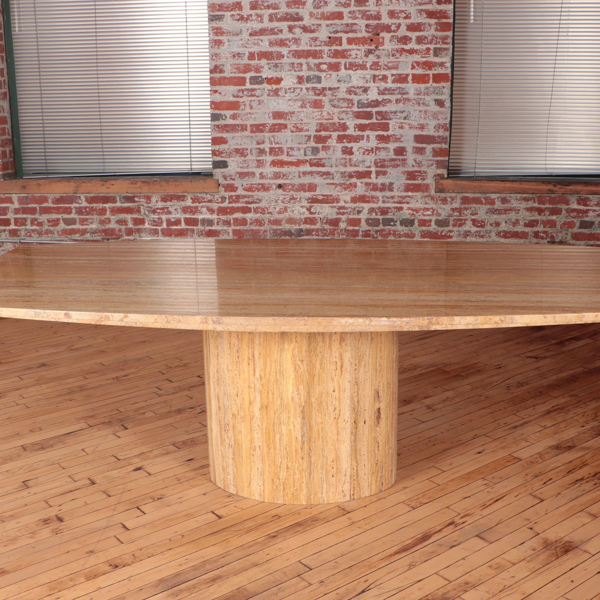 A monumental Iranian travertine pedestal dining room or conference room table. C 1970.