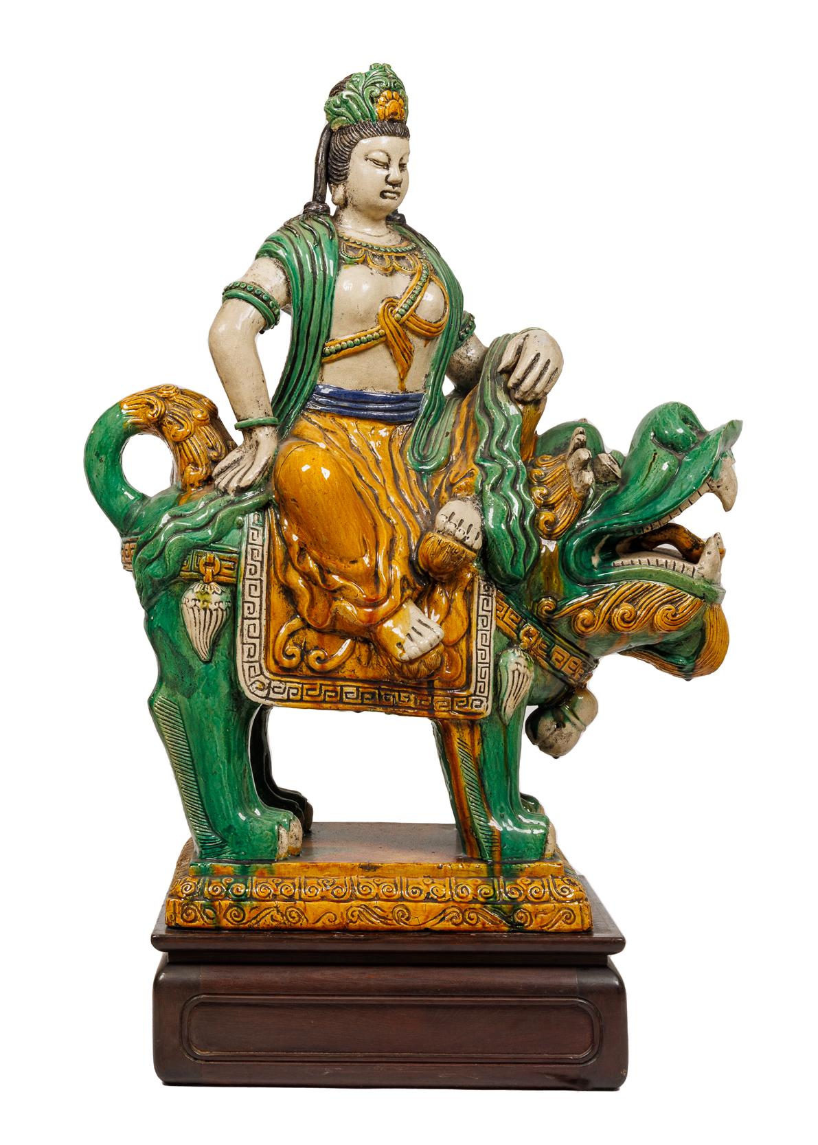 A Monumental pair of Chinese Sancai Glazed pottery figures / sculptures of Guan Yin and Lion on Wood Bases

Chinese sancai glazed figures of Guan Yin and lion are a type of ceramic artwork that originated in China during the Tang dynasty (618-907