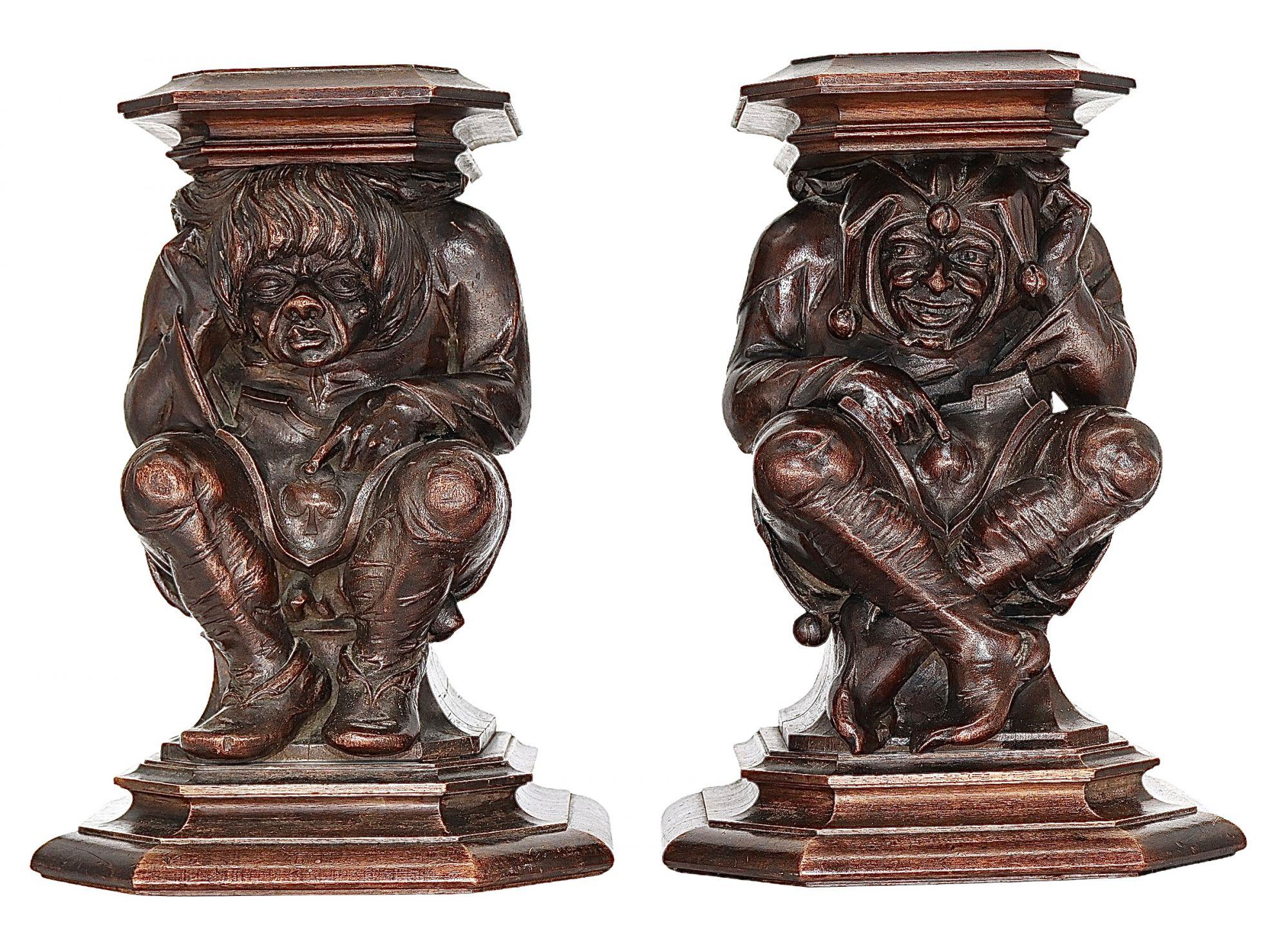 A very large and fine pair of 18th century carved figures, of Court Jesters. These gentlemen have been superbly carved in the finest detail, they original came from a piece of early 18th Century Furniture.Both the characters have finely detailed