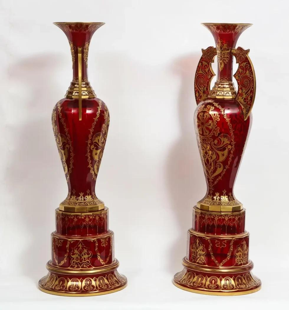 A monumental pair of ruby red gilt Bohemian 