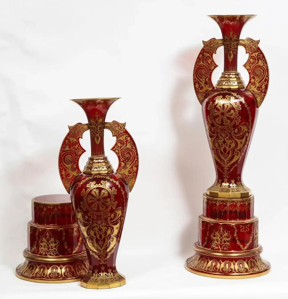 A monumental pair of ruby red gilt Bohemian 