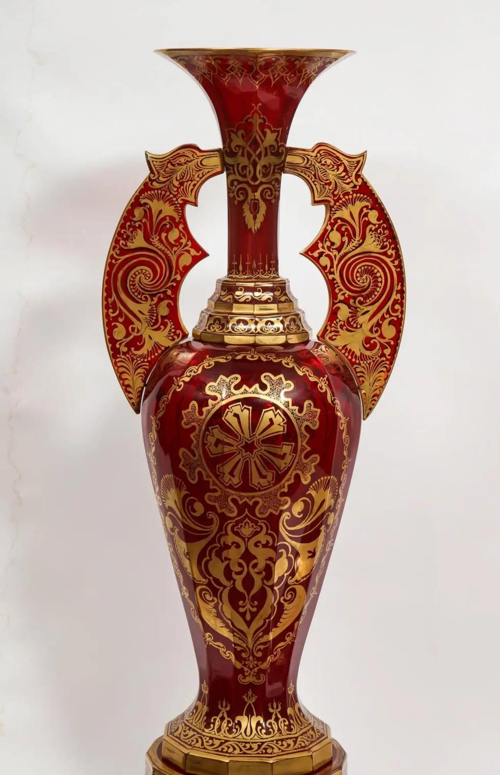 A monumental pair of ruby red gilt Bohemian 
