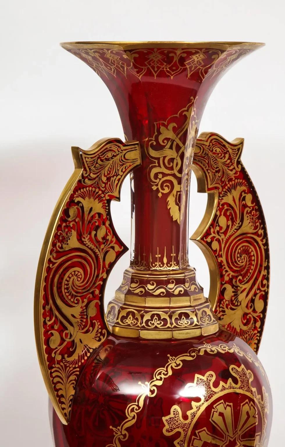 A monumental pair of ruby red gilt Bohemian 